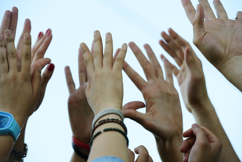 Group raising hands Group raising hands